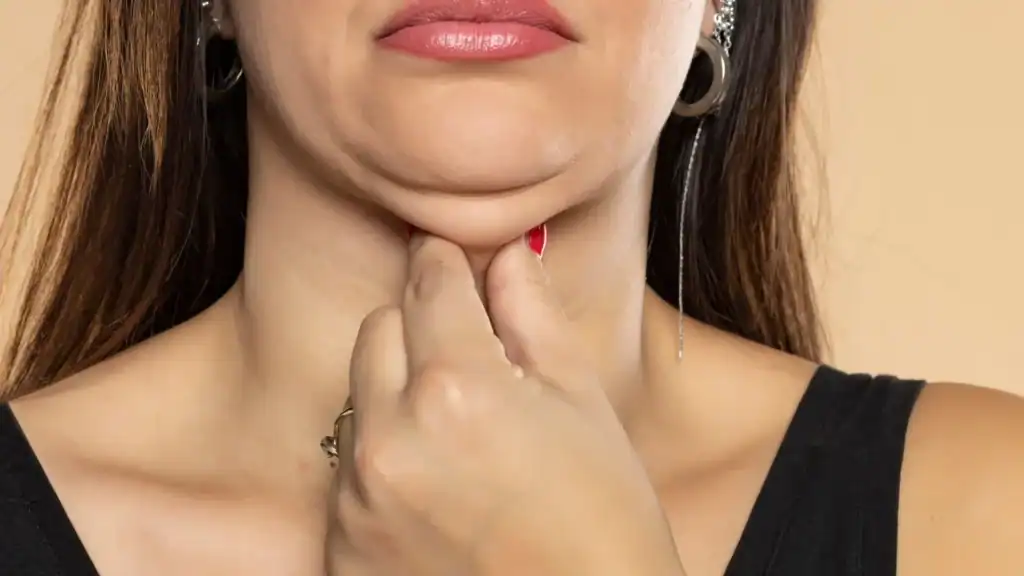 An image of a woman with double chin, sad, worried : Non Surgical Double Chin Removal Treatment in Oxted, UK